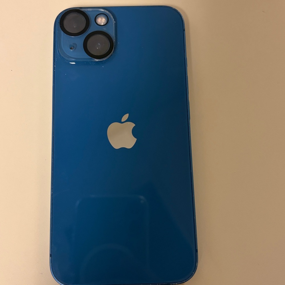 Apple iPhone 13 
Slight scratches on the phones edges 
comes with a clear case